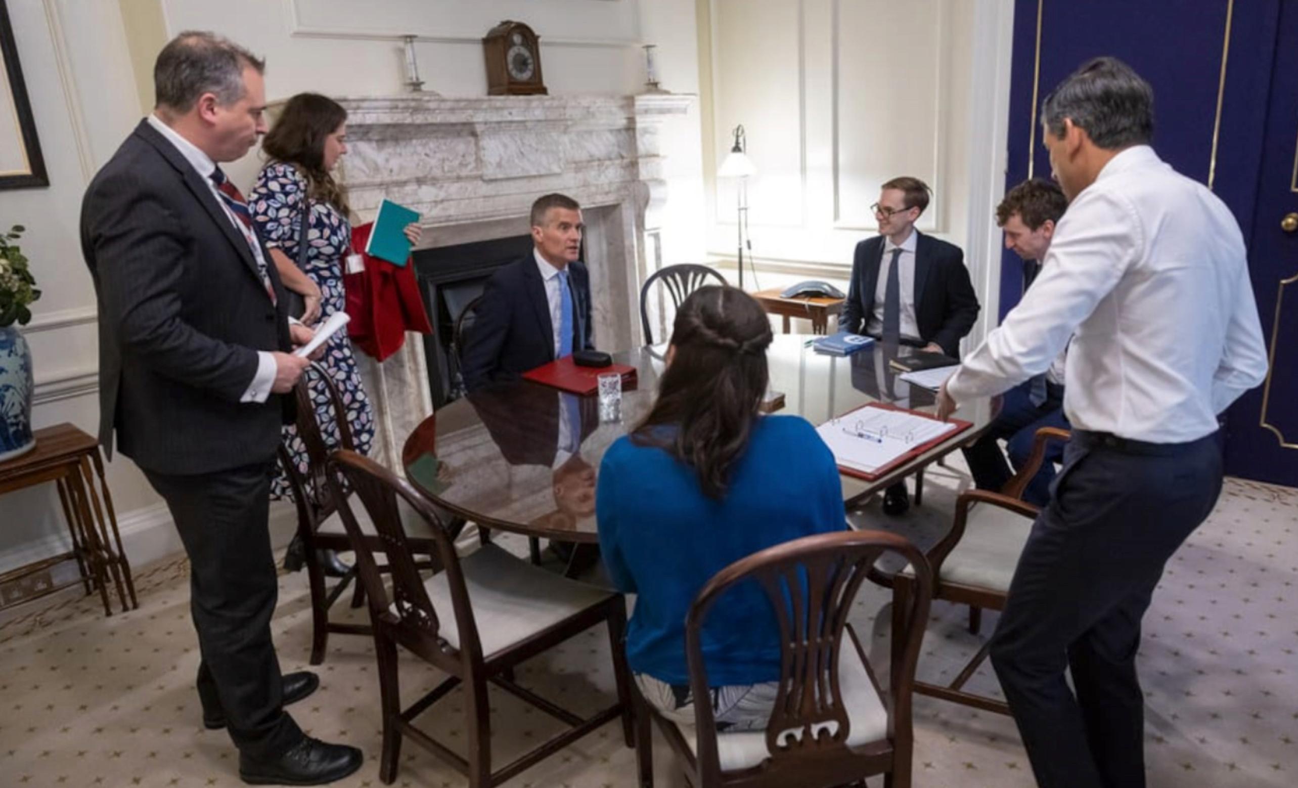 ‘Spad’ Richard Coates (left) in a team meeting with former Transport Secretary Mark Harper (seated).