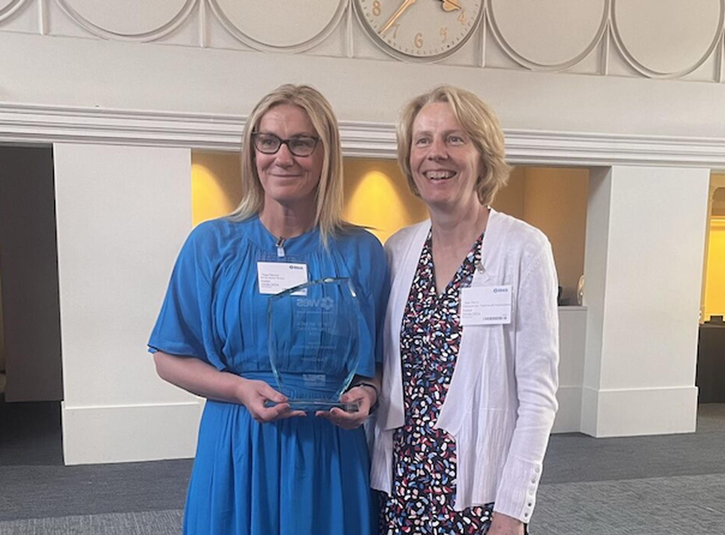 Tina Glover receives her Women in Engineering Award from Sue Percy, chief executive of the CIHT